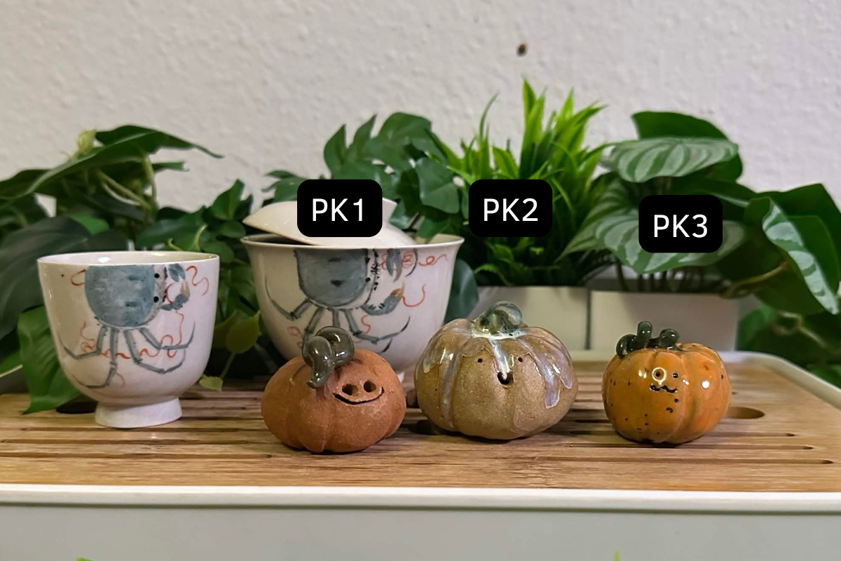 Three pumpkin tea pets: PK1 is dark orange and has a big dopey grin. PK2 is gold with a teensy silly smile. PK3 is bright orange with an UWU smile.