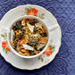 Teacup full of leaf and fruit