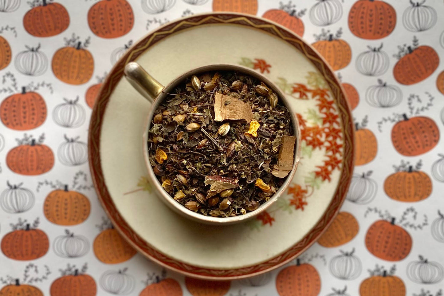 teacup full of leaf, grain, mushroom and squash