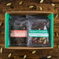 box of chai samples with two showing labeled "Nepali Breakfast" and "Friday's Evening"