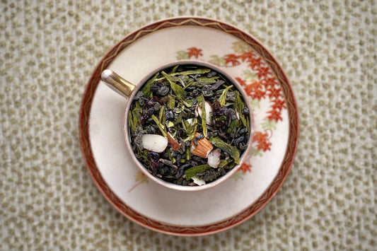 Autumnal teacup full of green teas and almonds