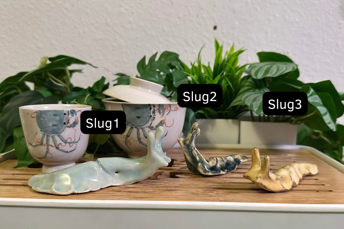 Three slug tea pets: Slug1 is celadon blue. Slug2 is swirled with dark blue and yellow. Slug3 is pale yellow.