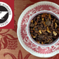 Cup of cacao nib, citrus & spice beside United Farm Workers logo