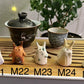 Five slug demon lookin tea pets on a bamboo tea tray
